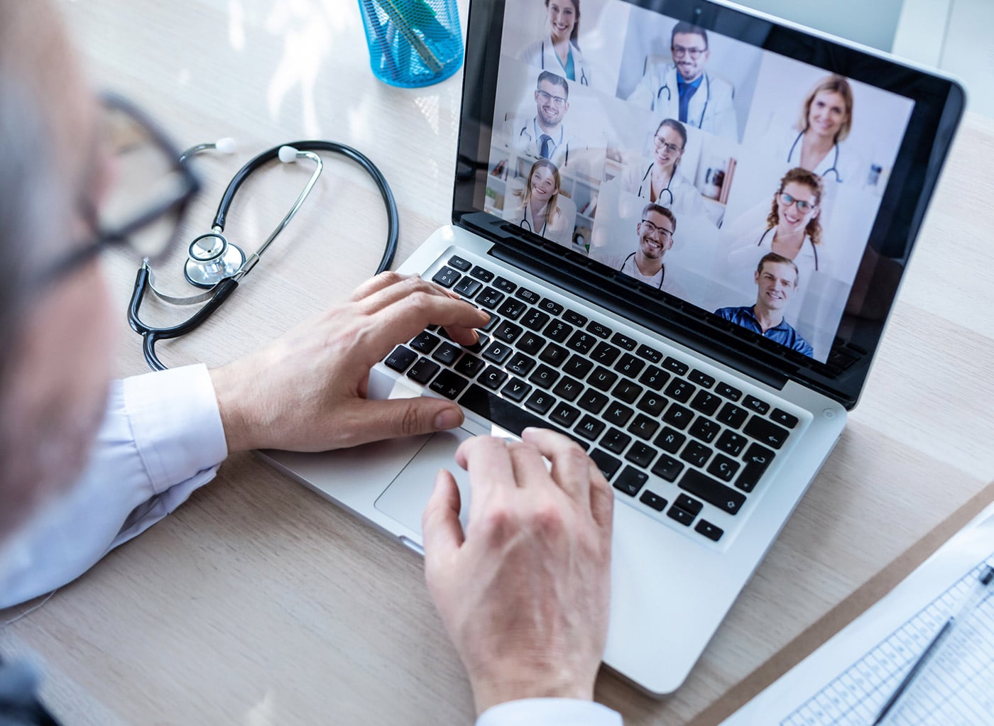 hands on laptop virtual meeting