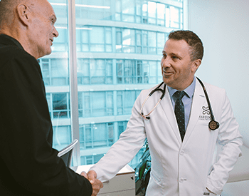 Dr. Glaze warmly greets patient